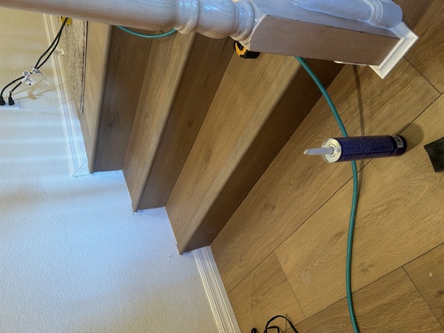Wood-look stair treads and risers during installation in a Las Vegas home