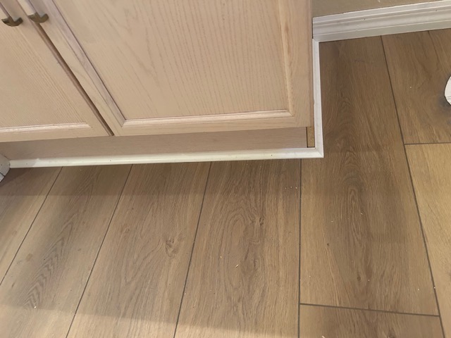 Oak wood-look flooring meeting a doorway in a Las Vegas home