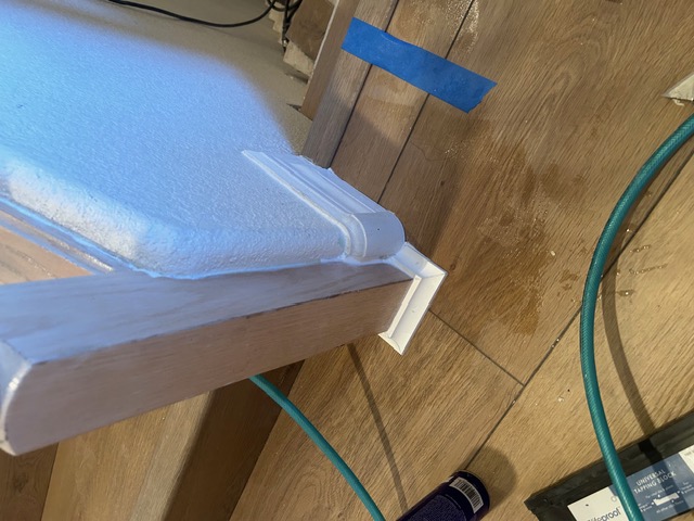 Baseboard and trim detail along new wood flooring in a Las Vegas home