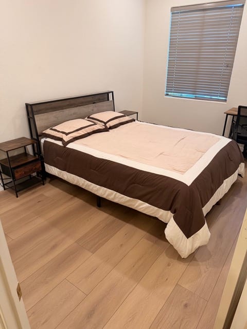 Completed light oak wood flooring in a Las Vegas bedroom