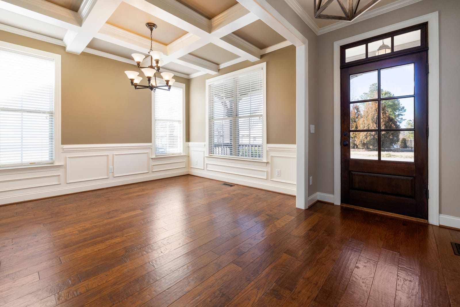 Rich dark hardwood flooring in a finished Las Vegas dining room