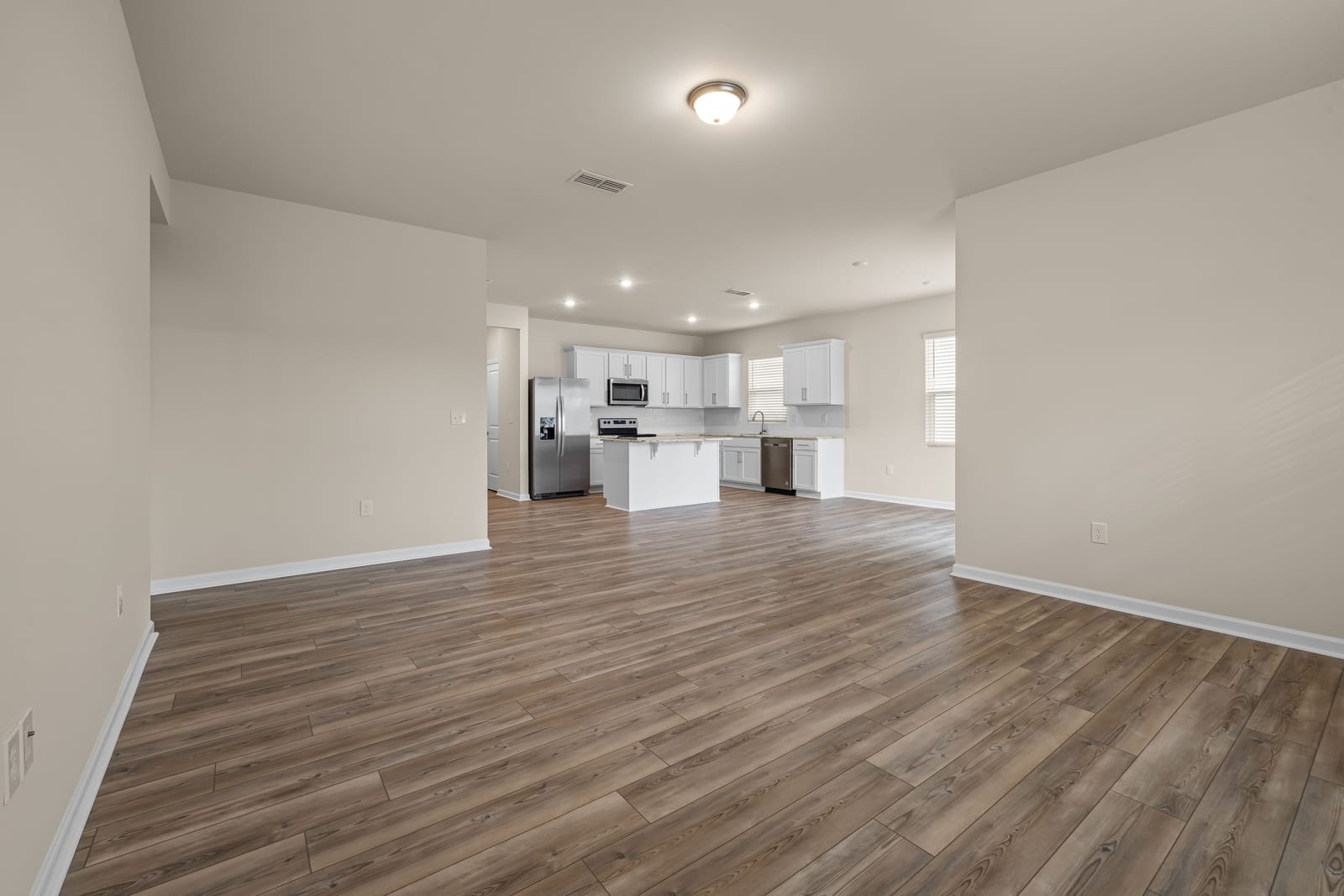 Gray luxury vinyl plank flooring in an open-plan Las Vegas home