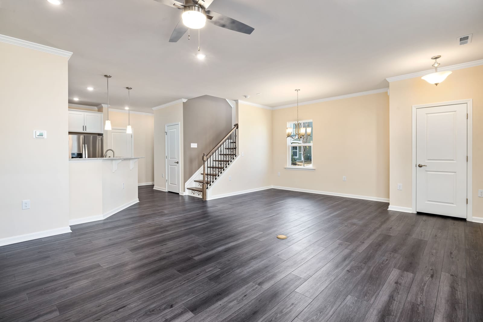 Gray luxury vinyl plank flooring in an open Las Vegas living room