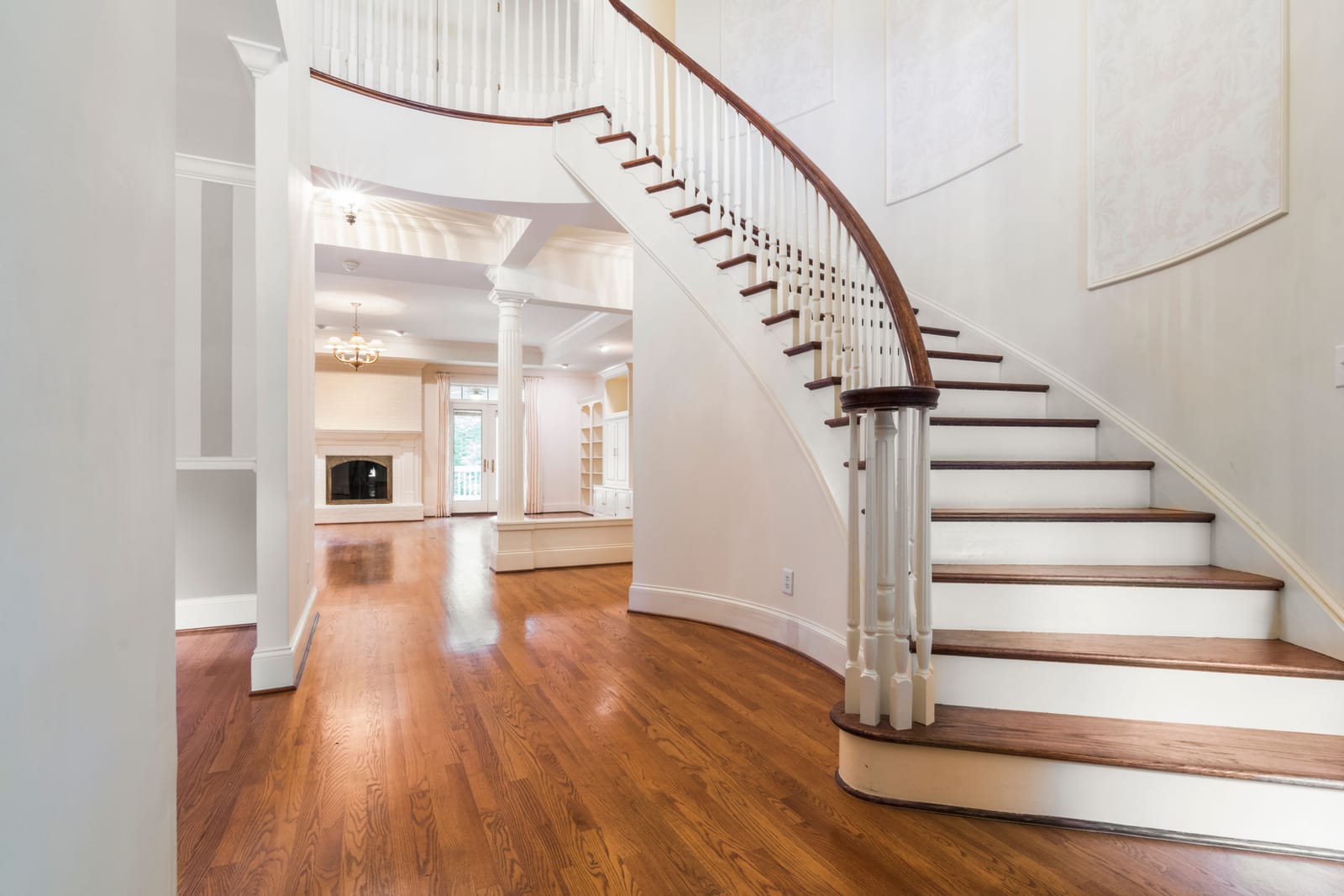 Curved staircase with wood treads and white risers in a Las Vegas home