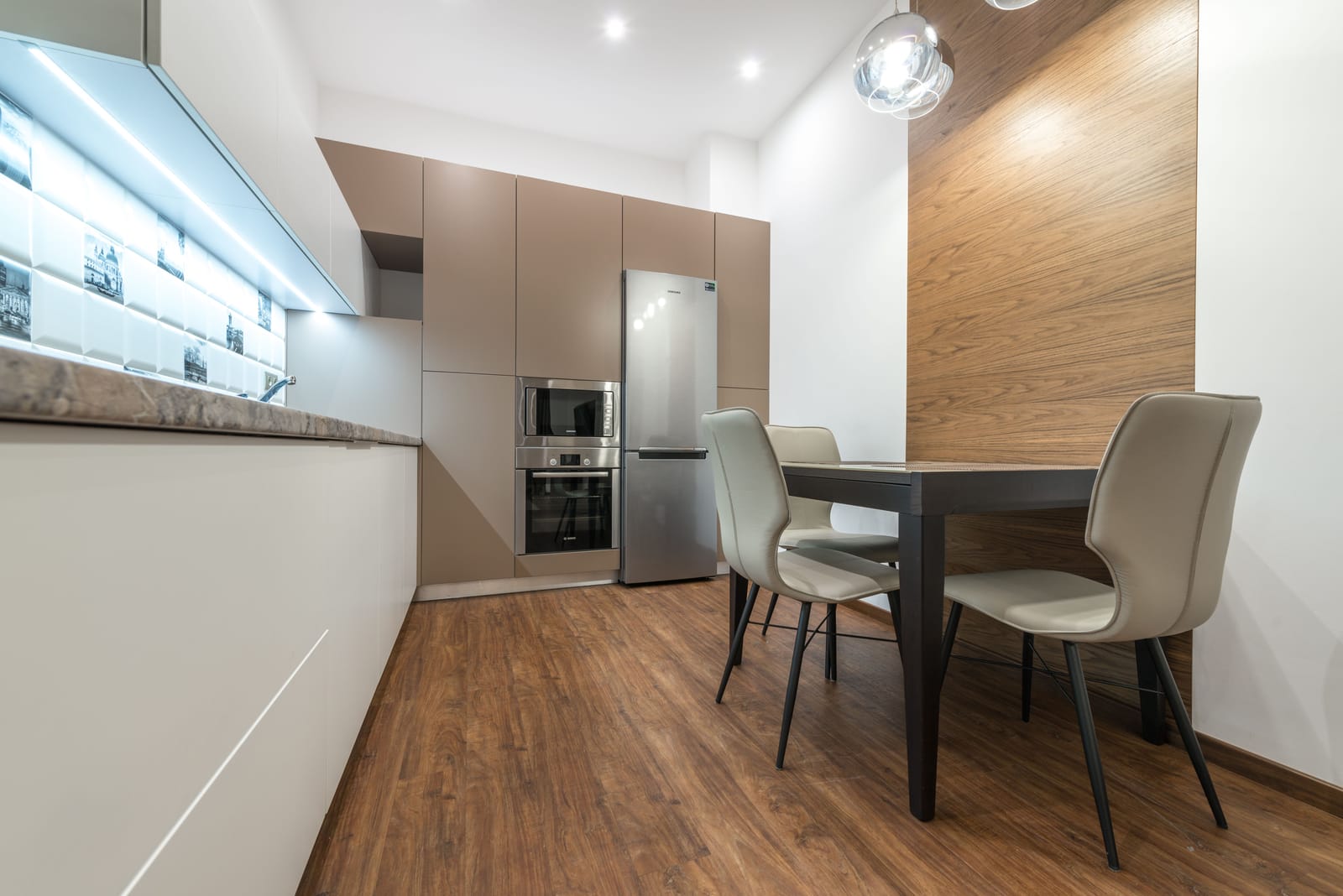 Warm wood-look plank flooring in a Las Vegas kitchen and dining area